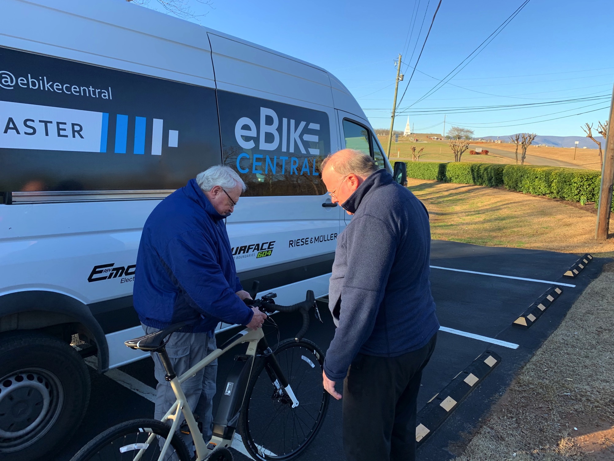 eBike Central's Joe Michel goes over features with customer Martin
